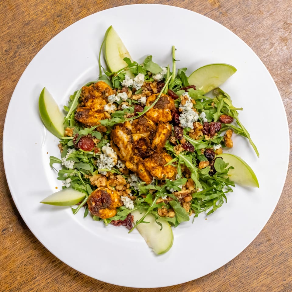 Murray's Restaurant & Deli's chicken salad with arugula, green apple slices, blue cheese, and walnuts.